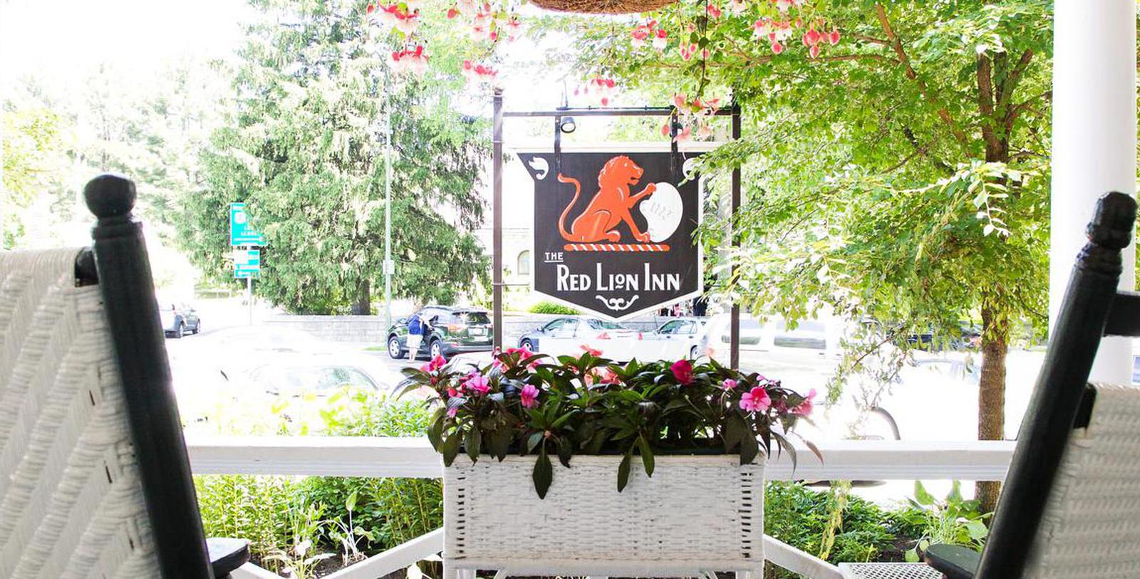 Image of Front Porch and Hotel Sign at The Red Lion Inn, 1773, Member of Historic Hotels of America, in Stockbridge, Massachusetts, Special Offers, Discounted Rates, Families, Romantic Escape, Honeymoons, Anniversaries, Reunions
