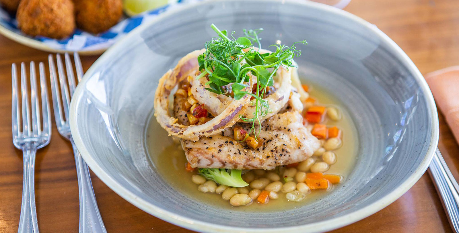 Taste the local flavors served at Hamilton Princess & Beach Club - A Fairmont Managed Hotel's historic restaurant, 1609.