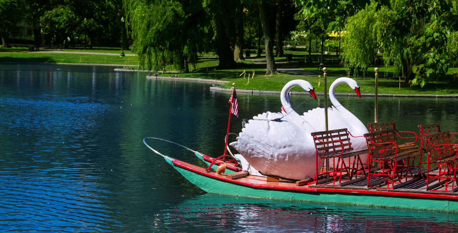 Experience a swan boat ride in the Boston Public Garden, the first public botanical garden in the United States.