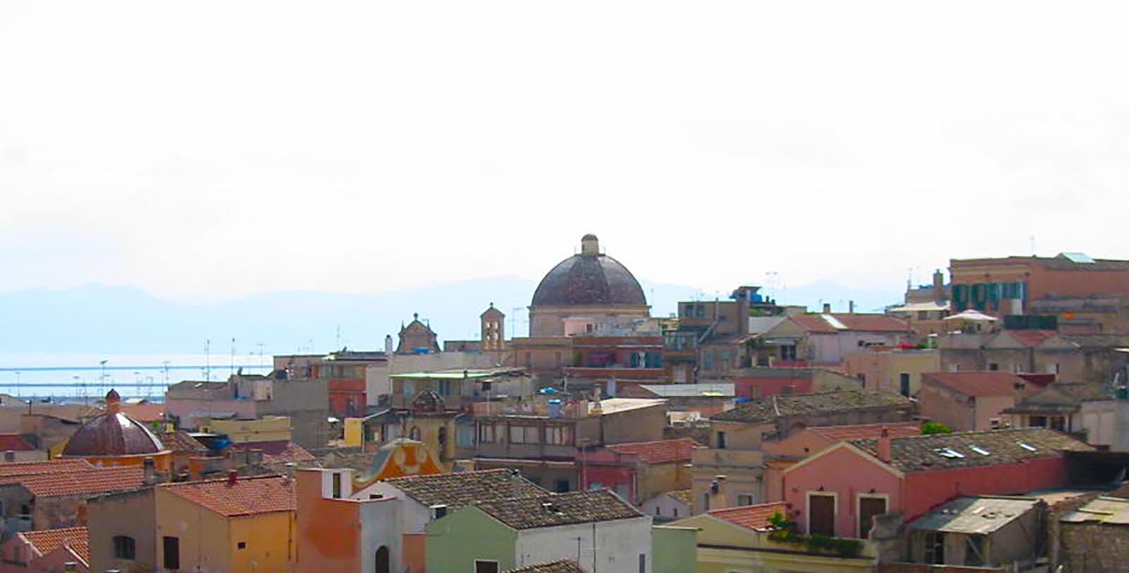 Saunter along the Via Roma, the famous promenade along the harbor of Cagliari, lined with porticos and filled with shops and eateries.