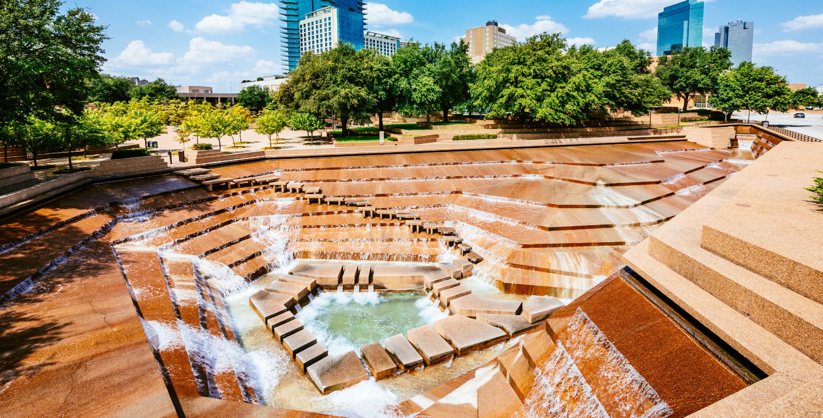 Experience Fort Worth Water Gardens by wading through waterfalls, pools, and fountains.