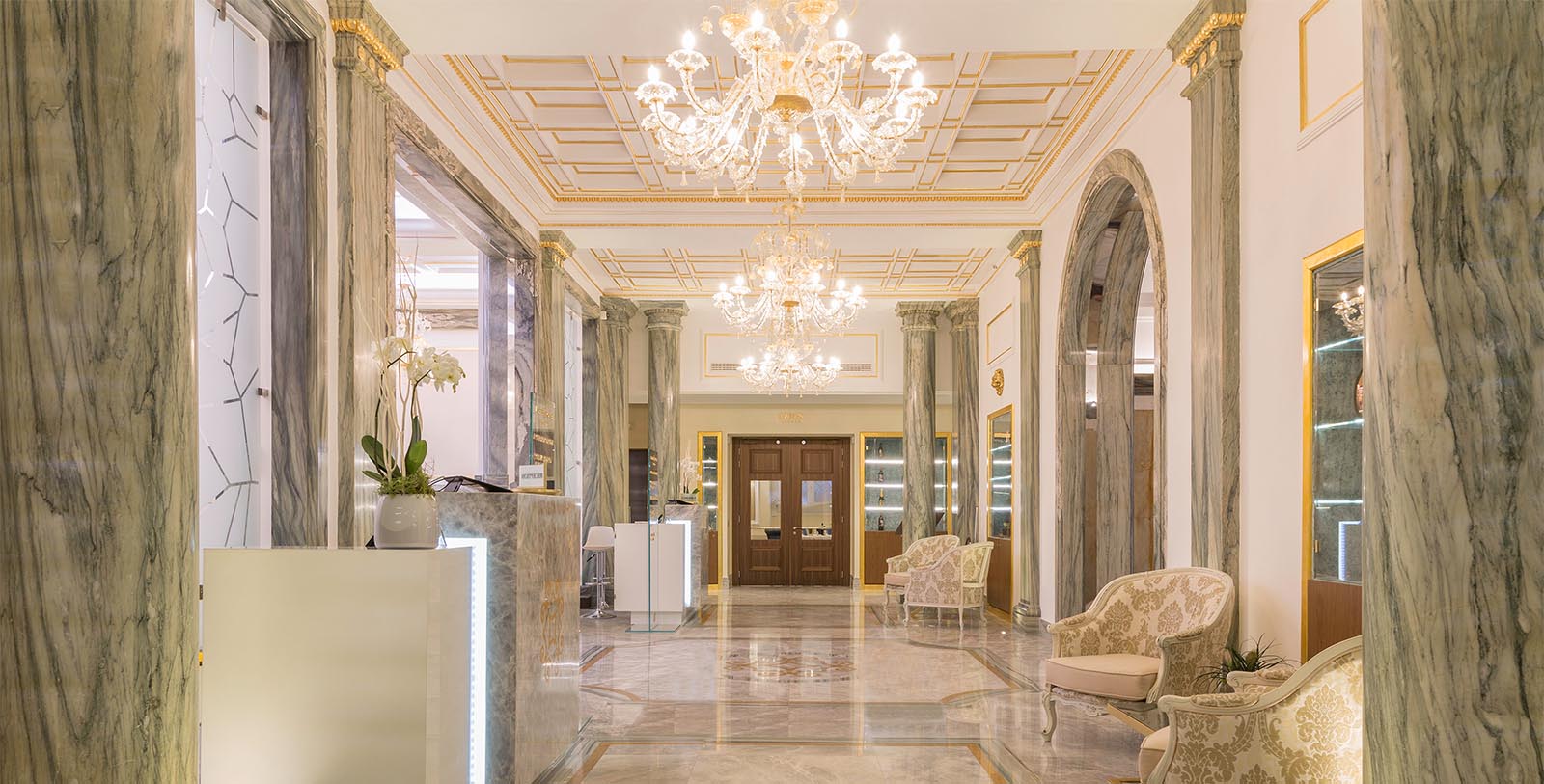 Discover the original green Cipollino marble used to construct the lobby of the Aleph Rome Hotel.