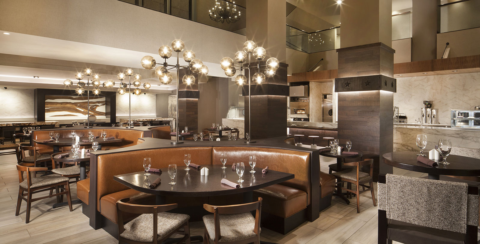 Taste cocktails under the stars at the Skylight Court Bar on Hilton Fort Worth's Promenade Level.