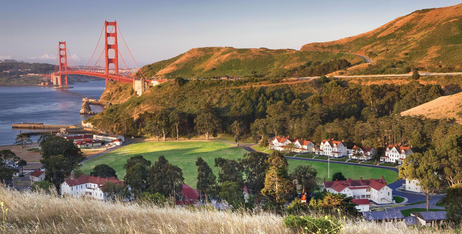Image of hotel exterior and golden gate bridge at Cavallo Point, 1901, Member of Historic Hotels of America, in San Francisco, California, Special Offers, Discounted Rates, Families, Romantic Escape, Honeymoons, Anniversaries, Reunions