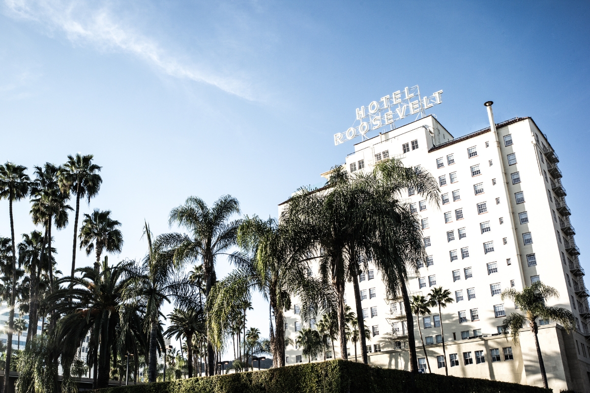 Image of Hotel Exterior with Palm Trees The Hollywood Roosevelt, 1927, Member of Historic Hotels of America, in Hollywood, California, Special Offers, Discounted Rates, Families, Romantic Escape, Honeymoons, Anniversaries, Reunions