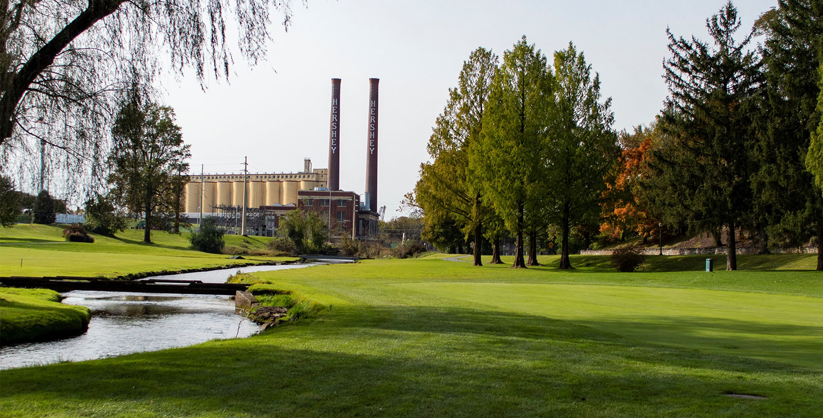 Image of Hotel Hershey's Golf Course with Chocolate Factory in the background, 1933, Member of Historic Hotels of America, Hershey, Pennsylvania, Golf
