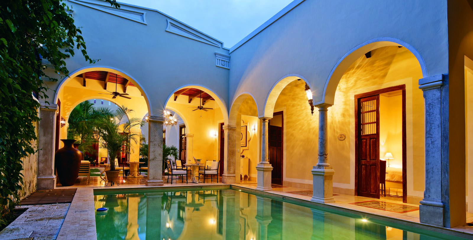 Image of outdoor pool area at night Casa Lecanda, 1900s, Member of Historic Hotels Worldwide, in Merida, Mexico, Hot Deals