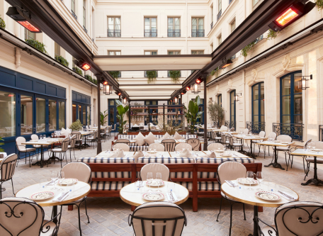 Image of courtyard dining area of La Chambre Bleue at Maison Delano Paris, a member of Historic Hotels Worldwide since 2023, located in Paris, France