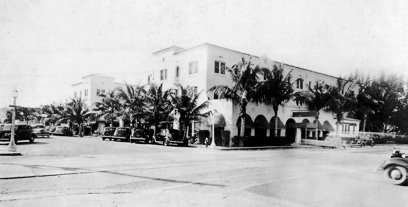 Discover the bright yellow Florida Mediterranean Revival-style façade of the Colony Hotel & Cabaña Club.