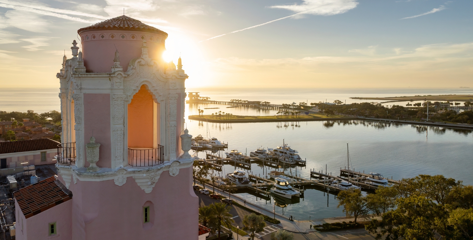 Discover the salmon-colored Mediterranean Revival-style façade of The Vinoy Resort & Golf Club, Autograph Collection.
