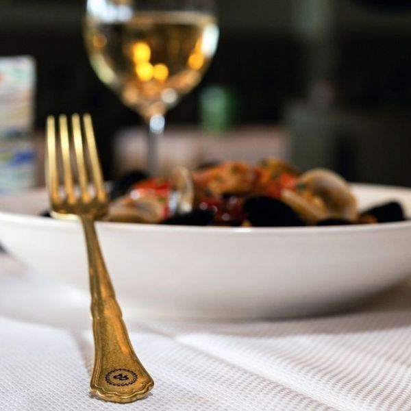 Hotel_Savoia__Jolanda__Venice_Italy_Credit_Historic_Hotels_Worldwide_and_Hotel_Savoia__Jolanda_-_A_Golden_Fork_Resting_On_A_Plate_Served_At_Ristorante_Principessa.jpg.jpg
