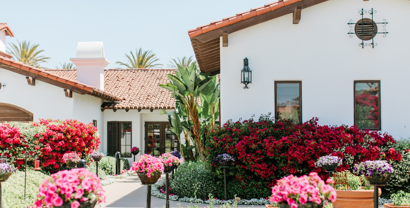 Discover the Spanish Colonial-style façade of the Omni La Costa Resort.
