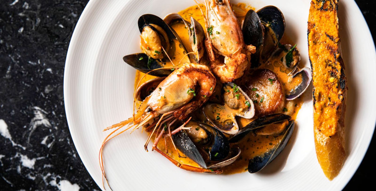 Taste delicious, fresh seafood at Shuckers at Fairmont Olympic Hotel - Seattle, one of Seattle’s most historic and preeminent oyster bars.