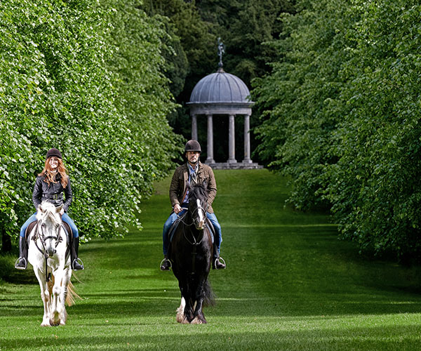 Couple Horseback Riding
