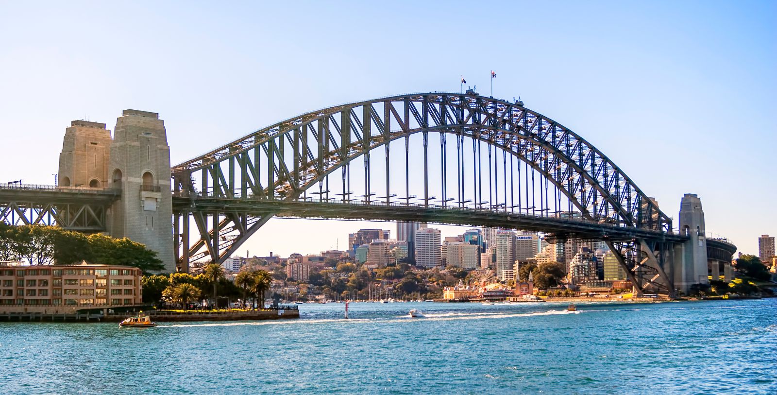 Climb the Sydney Harbour Bridge, a towering steel arch that spans Sydney Harbour, connecting the Central Business District with the North Shore.