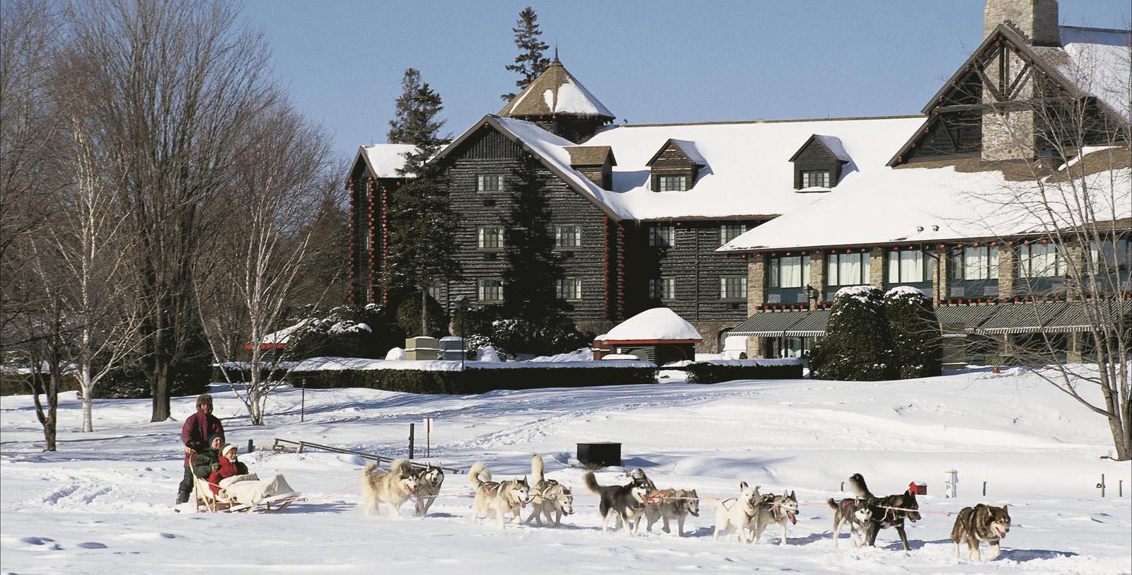 Image of Guests Dog Sledding Fairmont Le Château Montebello, 1930, Member of Historic Hotels Worldwide, in Montebello, Quebec, Hot Deals