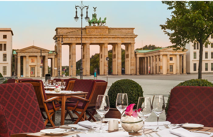 Daytime exterior patio seating at Hotel Adlon Kempinski in Berlin, Germany.