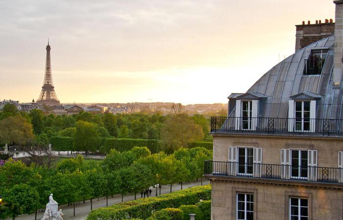 Daytime view of the Eiffel Tower from the Hotel Regina Louvre in Paris, France.