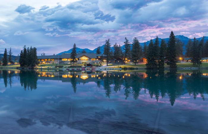 Dusk exterior of the Fairmont Jasper Park Lodge in Alberta, Canada.